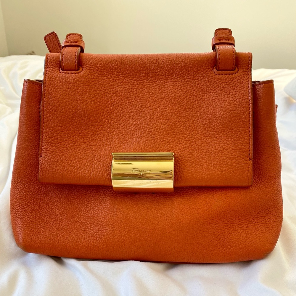 Salvatore Ferragamo bright orange crossbody.